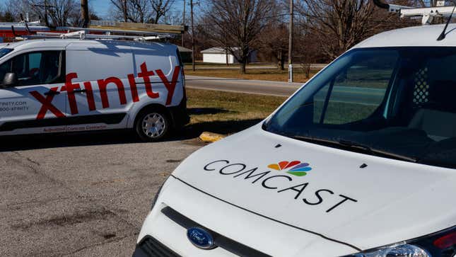 A Comcast service vehicle sitting next to an Xfinity service vehicle.