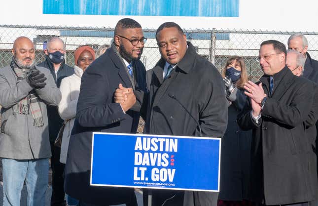State Rep. Austin Davis, left, a Democrat from the Mon Valley, receives support from Pittsburgh Mayor Ed Gainey after Mr. Davis announces his plans to enter the race to become Pennsylvania’s next lieutenant governor Tuesday, Jan. 4, 2022, in McKeesport, Pa. At right is Democratic candidate for governor of Pennsylvania, state Attorney General Josh Shapiro.