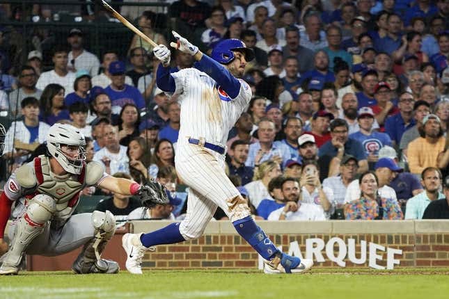 Aug 1, 2023; Chicago, Illinois, USA; Chicago Cubs right fielder Mike Tauchman (40) hits a three-run homer against the Cincinnati Reds during the third inning at Wrigley Field.