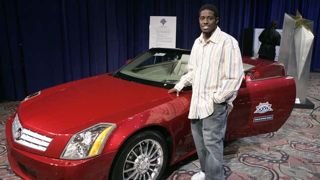 Deion Branch of the New England Patriots with the Cadillac XLR awarded to the MVP for Super Bowl XXXIX, February 7, 2005.