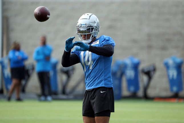 Lions wide receiver Amon-Ra St. Brown catches passes during training camp on Wednesday, Aug. 02, 2023, in Allen Park.