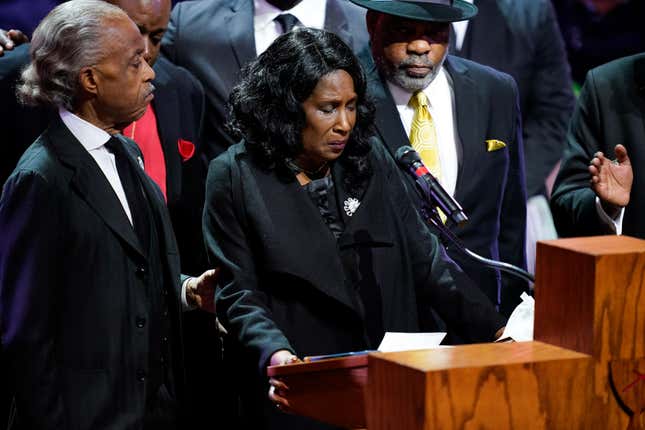 MEMPHIS, TN - FEBRUARY 01: Flanked by Rev. Al Sharpton and her husband Rodney Wells, RowVaughn Wells speaks during the funeral service for her son Tyre Nichols at Mississippi Boulevard Christian Church on February 1, 2023 in Memphis, Tennessee. 