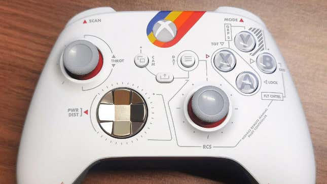 A Starfield Xbox controller shows retro sci-fi design elements. 