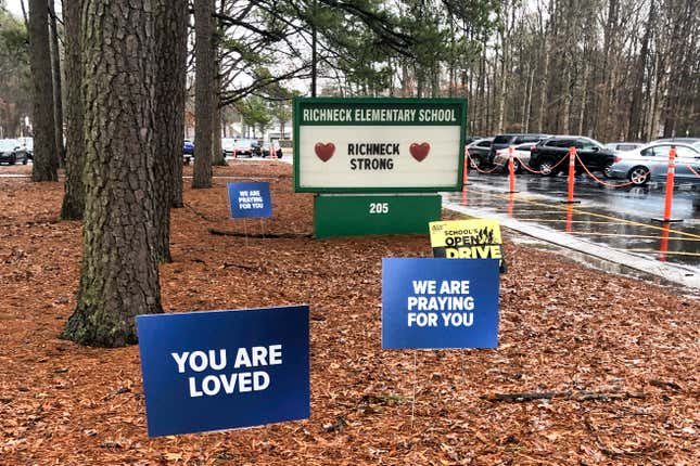 Signs stand outside Richneck Elementary School in Newport News, Va., on Jan. 25, 2023. The school is set to reopen Monday, Jan. 30, more than three weeks after a Jan. 6 shooting. Police have said a boy brought a 9mm handgun to school and intentionally shot his teacher, Abby Zwerner, as she was teaching her first-grade class.