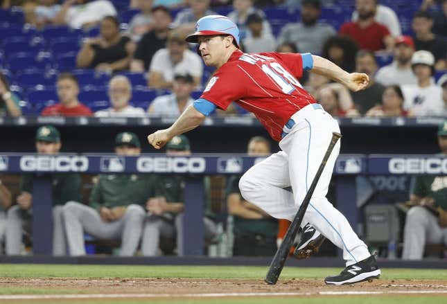 Jun 3, 2023; Miami, Florida, USA; Miami Marlins shortstop Joey Wendle (18) doubles against the Oakland Athletics during the second inning at loanDepot Park.