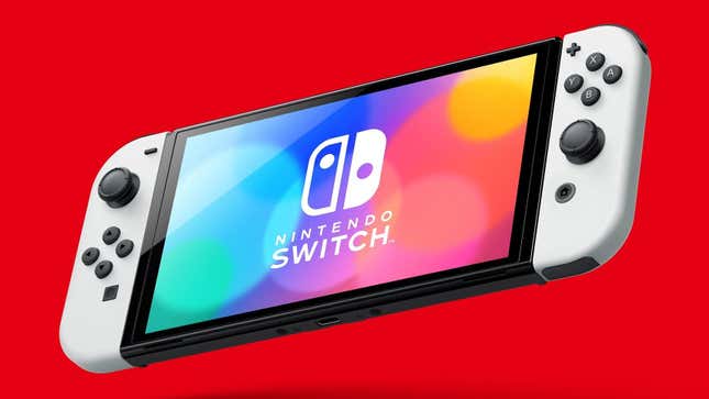 A Switch OLED hangs in front of a red background. 