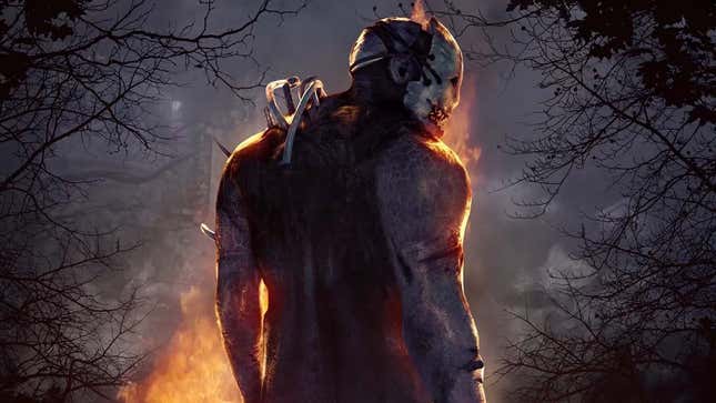 A creepy, large killer wearing a white skull-like mask stands in front of a fire pit. 