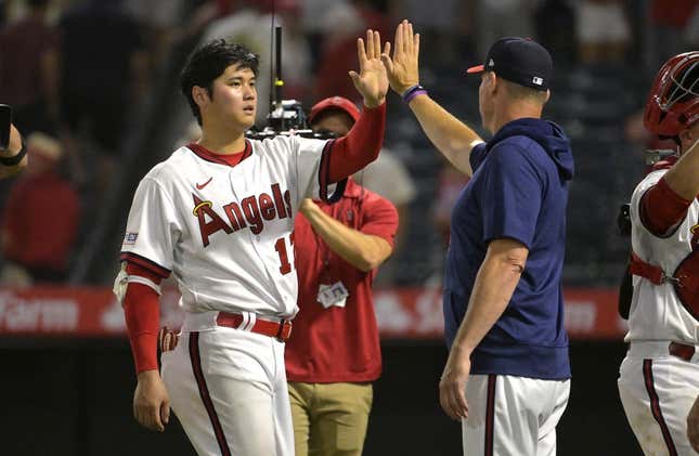 Jul 21, 2023; Anaheim, California, USA; Los Angeles Angels starting pitcher Shohei Ohtani (17) high fives as he leaves the field following the ninth inning against the Pittsburgh Pirates at Angel Stadium.