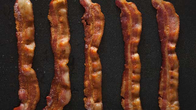 five strips of bacon in pan
