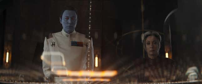 Grand Admiral Thrawn and Morgan Elsbeth look at a hologram tactical map.