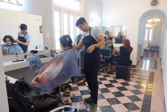 Cassandra hired a designer to turn an apartment she inherited into a fully working salon.