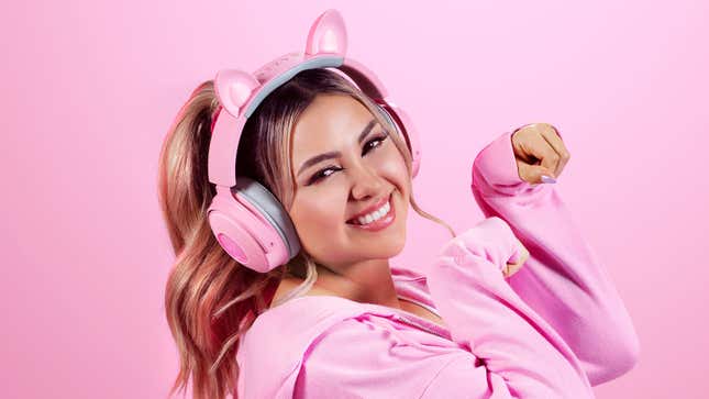 The Kraken Kitty V2 Pro headphones with cat ears attached worn on a model's head.