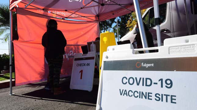 People check-in for their covid-19 vaccine at a pop-up clinic offering vaccines and booster shots in Rosemead, California on November 29, 2021