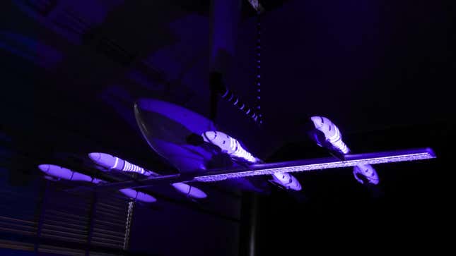 Image of Eve's eVTOL suspended in a wind tunnel