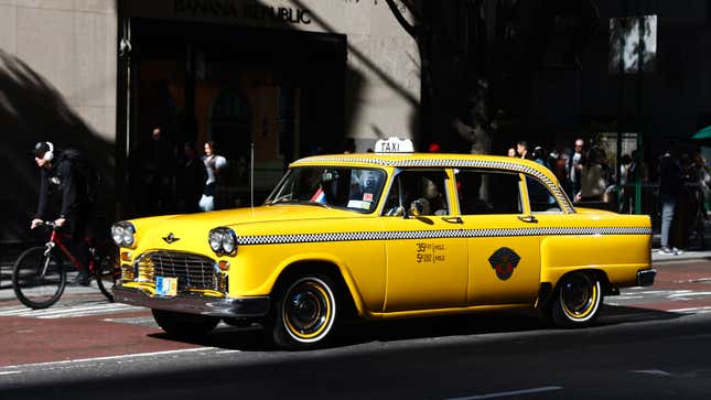 A photo of a yellow taxi cab in New York City. 
