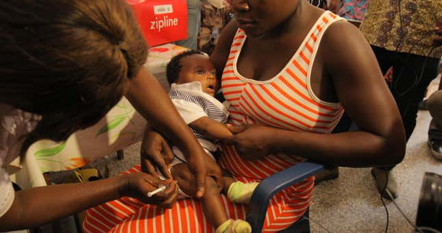 A child at New Tafo Hospital being given a yellow fever vaccine shot after a drone delivery