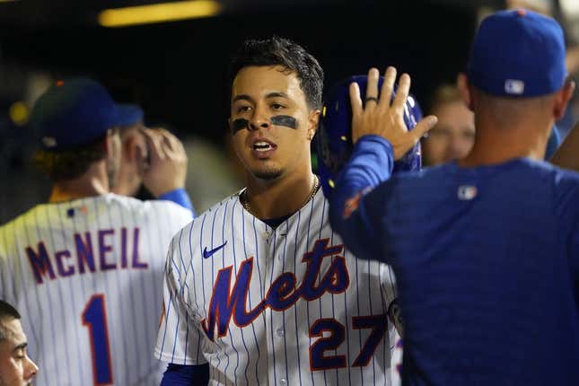 Sep 13, 2023; New York City, New York, USA; New York Mets designated hitter Mark Vientos (27) is congratulated by teammates for hitting a home run against the Arizona Diamondbacks during the sixth inning at Citi Field.