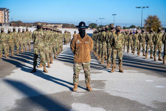 A Space Force military training instructor standing in front of his troops during a 2020 graduation ceremony held in San Antonio-Lackland, Texas.