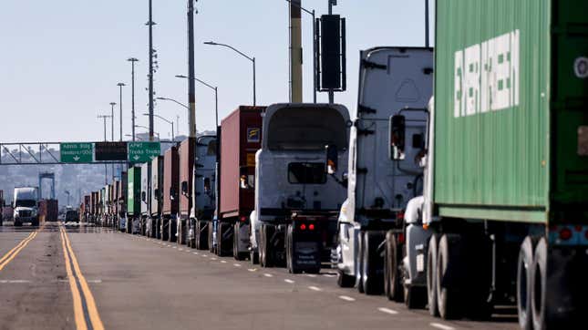 Trucks are lined up at the Port of Los Angeles on November 24, 2021 in San Pedro, California. 