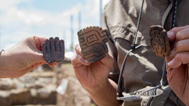 Several carved stone figures found on the site.