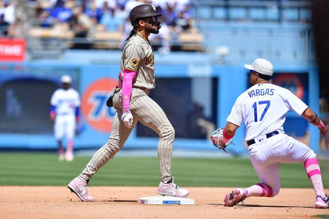 May 14, 2023; Los Angeles, California, USA; San Diego Padres right fielder Fernando Tatis Jr. (23) steals second against Los Angeles Dodgers second baseman Miguel Vargas (17) during the eighth inning at Dodger Stadium.