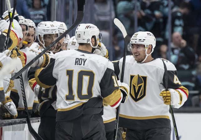 Apr 13, 2023; Seattle, Washington, USA; Las Vegas Knights players including forward Nicolas Roy (10) and forward Ivan Barbashev (49), right, celebrate and empty-net goal during the third period at Climate Pledge Arena.
