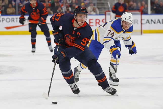 Oct 18, 2022; Edmonton, Alberta, CAN; Buffalo Sabres forward Rasmus Asplund (74) chases Edmonton Oilers forward Connor McDavid (97) up the ice during the third period at Rogers Place.