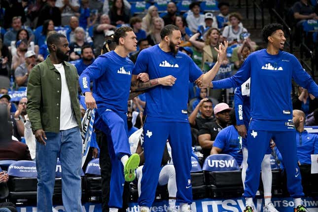 Apr 9, 2023; Dallas, Texas, USA; Dallas Mavericks forward Tim Hardaway Jr. (11) and center Dwight Powell (7) and center JaVale McGee (00) and forward Christian Wood (35) celebrate on the team bench during the second quarter against the San Antonio Spurs at the American Airlines Center.