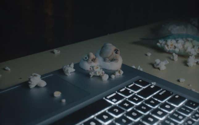 two shells on a lap top with pop corn