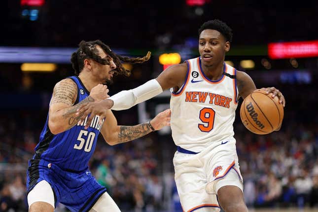 Mar 23, 2023; Orlando, Florida, USA;  New York Knicks guard RJ Barrett (9) controls the ball from Orlando Magic guard Cole Anthony (50) in the second quarter at Amway Center.
