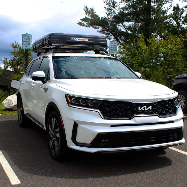 A photo of a packed away Roofnest Condor tent on top of a Kia SUV.