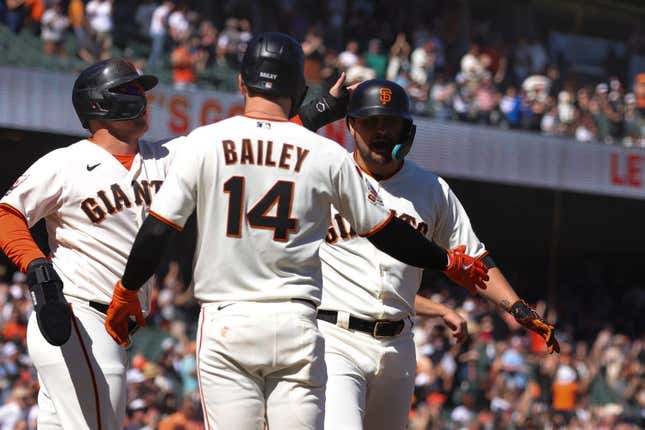 Sep 13, 2023; San Francisco, California, USA; San Francisco Giants third baseman J.D. Davis (7) is congratulated after hitting a three run home run during the eighth inning against the Cleveland Guardians at Oracle Park.
