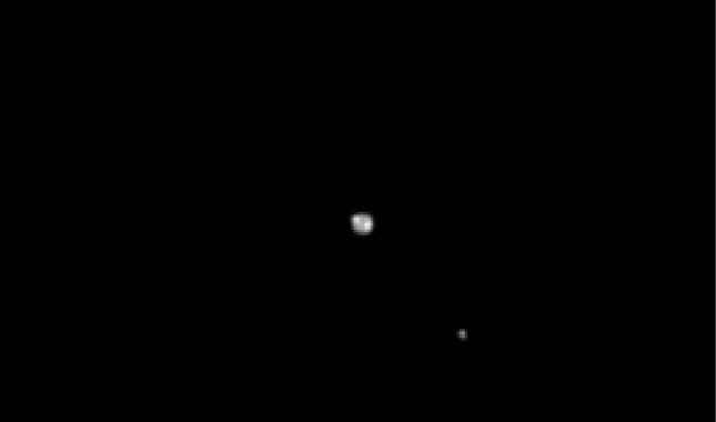 Pluto and Charon when New Horizons was 69 million miles (111 million kilometers) away.
