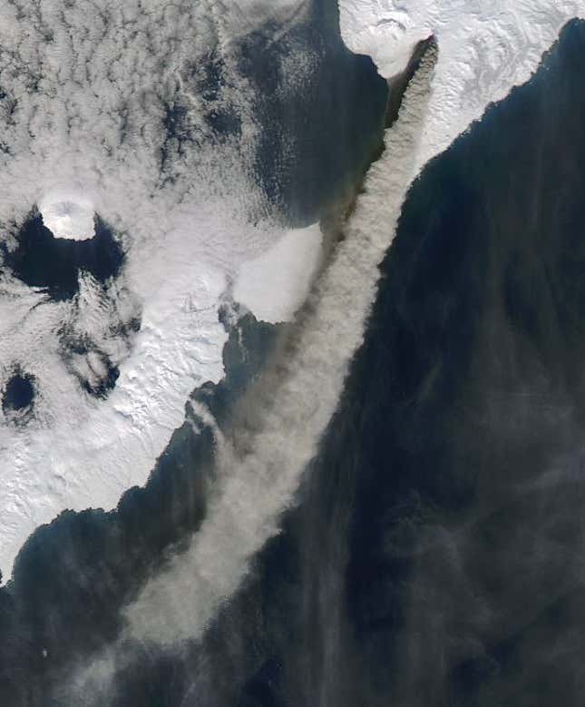 An ash plume measuring 100 km (60 miles) flows from the Kambalny crater, in the upper right hand corner of the photo, towards the south and the southwest of the Kamchatka Peninsula, Russia, March 25. (NASA Earth Observatory/MODIS)