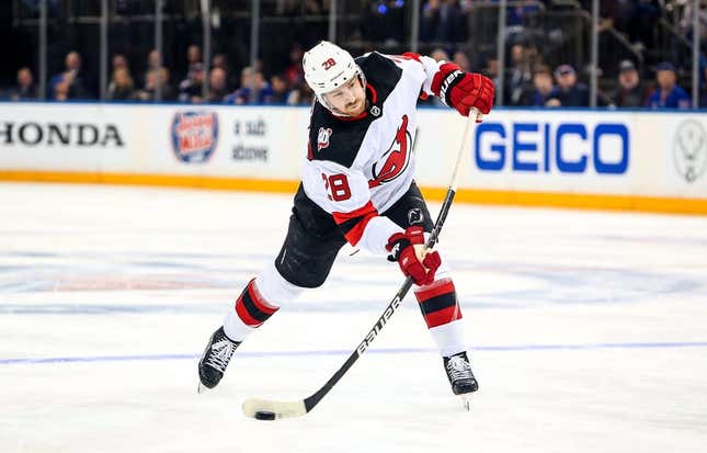 Apr 29, 2023; New York, New York, USA; New Jersey Devils defenseman Damon Severson (28) takes a shot against the New York Rangers during the third period in game six of the first round of the 2023 Stanley Cup Playoffs at Madison Square Garden.