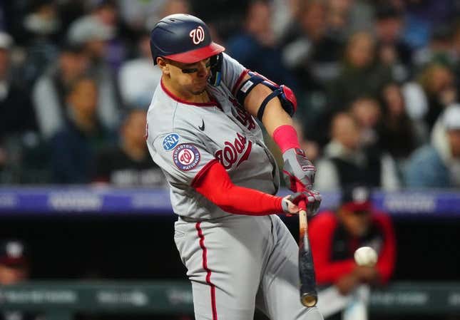 Apr 8, 2023; Denver, Colorado, USA; Washington Nationals first baseman Joey Meneses (45) doubles in the fifth inning against the Colorado Rockies at Coors Field.