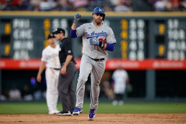 Jun 27, 2023; Denver, Colorado, USA; Los Angeles Dodgers designated hitter J.D. Martinez (28) gestures as he rounds the bases on a solo home run in the sixth inning against the Colorado Rockies at Coors Field.