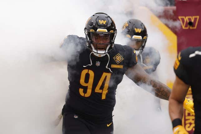 Nov 6, 2022; Landover, Maryland, USA; Washington Commanders defensive tackle Daron Payne (94) runs out of the tunnel with teammates prior to their game against the Minnesota Vikings at FedExField.