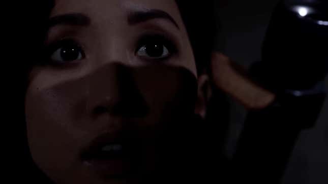 Brenda Song points a flashlight in The Quarry.