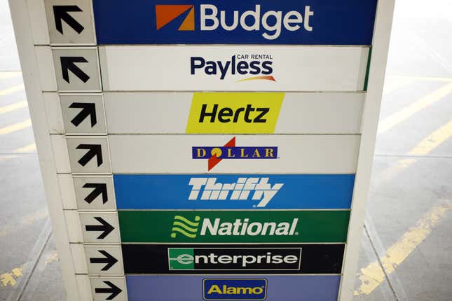 Budget, Payless, Hertz, Dollar, Thrifty, National, Enterprise and Alamo rental car signage at the Louisville International Airport in Louisville, Kentucky, U.S.