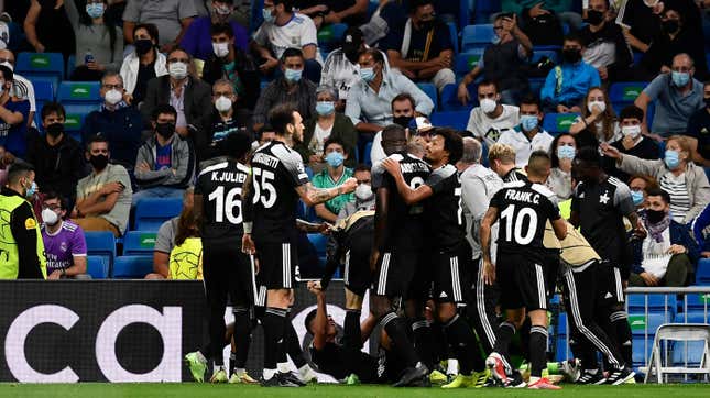 Sheriff’s Sebastien Thill celebrates with teammates after scoring his side’s second goal during the Champions League match between Real Madrid and Sheriff, Tiraspol at the Bernabeu stadium in Madrid, Spain.
