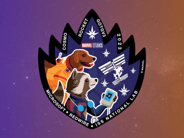 The mission patch, featuring Rocket and Cosmo. 