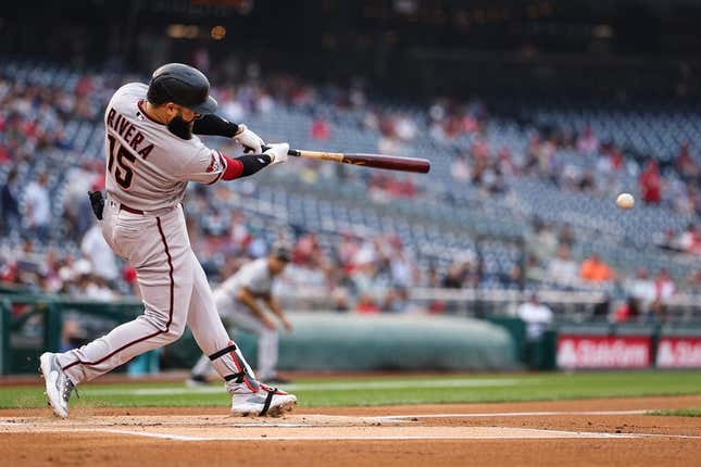 Jun 7, 2023; Washington, District of Columbia, USA; Arizona Diamondbacks third baseman Emmanuel Rivera (15) hits a 2 RBI double against the Washington Nationals during the first inning at Nationals Park.