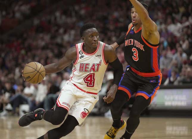 Mar 3, 2023; Miami, Florida, USA;  Miami Heat guard Victor Oladipo (4) drives to the basket past New York Knicks guard Josh Hart (3) during the second half at Miami-Dade Arena.