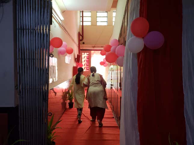 Two women enter the all-women polling booth in Bombay.