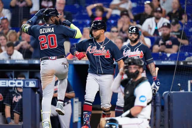 May 4, 2023; Miami, Florida, USA; Atlanta Braves designated hitter Marcell Ozuna (20) celebrates with teammates after hitting a home run against the Miami Marlins during the fourth inning at loanDepot Park.