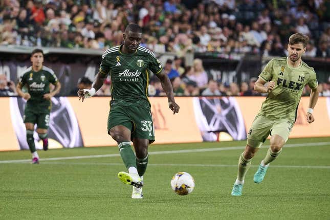 Sep 9, 2023; Portland, Oregon, USA; Portland Timbers defender Larrys Mabiala (33) kicks the ball during the first half against Los Angeles FC forward Mario Gonzalez (9) at Providence Park.