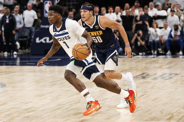 Apr 23, 2023; Minneapolis, Minnesota, USA; Minnesota Timberwolves guard Anthony Edwards (1) drives while Denver Nuggets forward Aaron Gordon (50) defends during overtime of game four of the 2023 NBA Playoffs at Target Center.