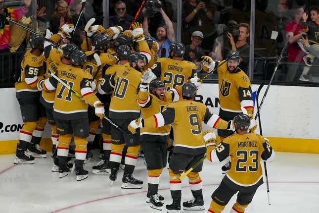 May 21, 2023; Las Vegas, Nevada, USA; The Vegas Golden Knights celebrate after center Chandler Stephenson (20) scores the game wining goal against the Dallas Stars during the overtime period in game two of the Western Conference Finals of the 2023 Stanley Cup Playoffs at T-Mobile Arena.