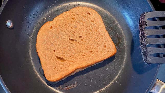 Coffee French toast frying in a splash of butter.